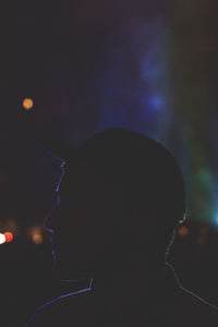 Close-up portrait of silhouette man performing at music concert