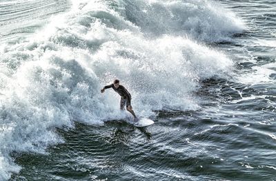 High angle view of man surfing in sea