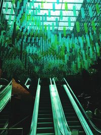 Low angle view of illuminated modern buildings in city
