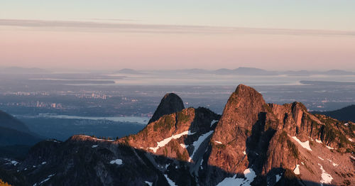 Scenic view of mountains against sky during sunset