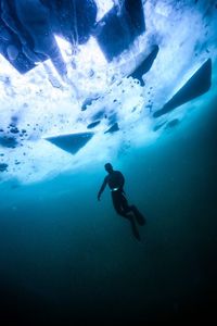 Person swimming undersea