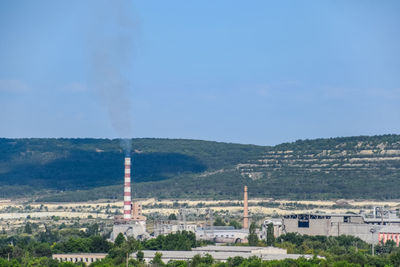 Aerial view of factory against sky
