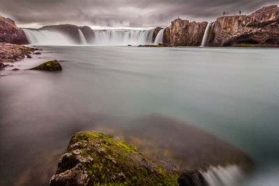 Scenic view of expansive waterfall with smooth foreground from long-exposure