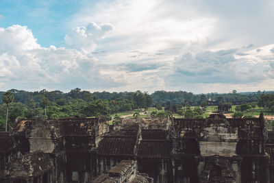 View of old temple against cloudy sky