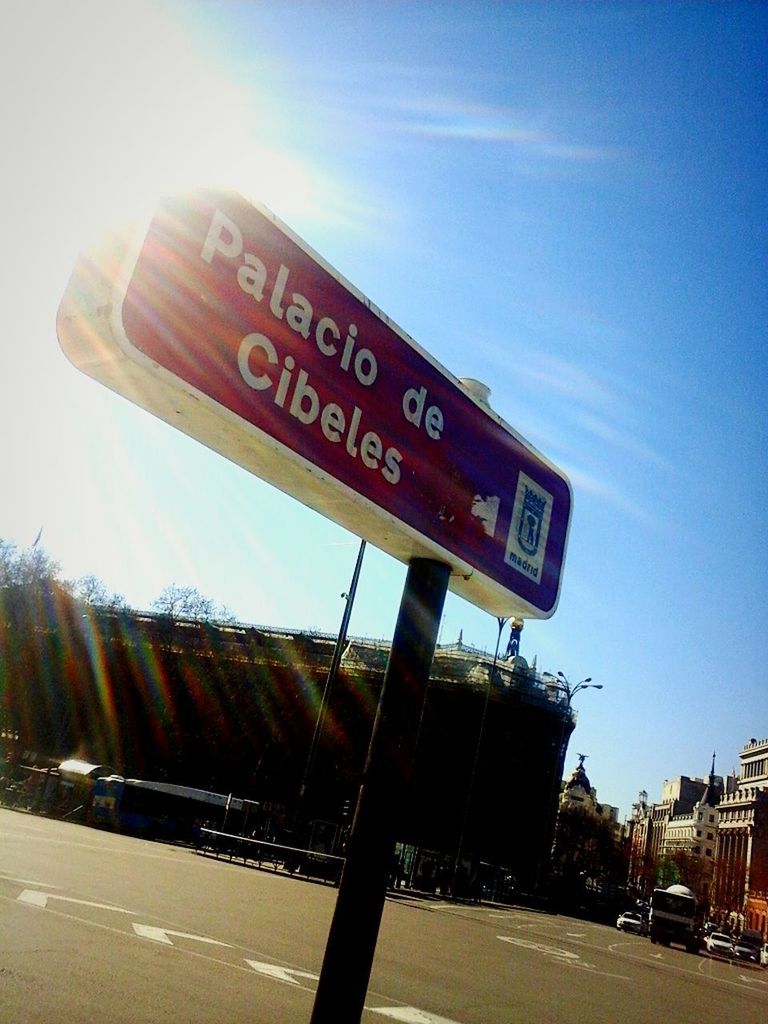 CLOSE-UP OF ROAD SIGN AGAINST SKY