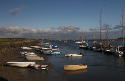 Boats moored at harbor