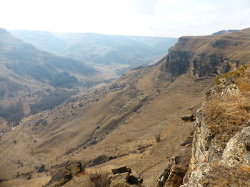 Scenic view of landscape and mountains against sky