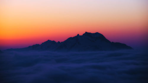 Scenic view of mountains against sky during sunset