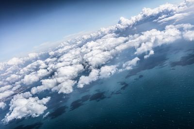 Scenic view of mountains against cloudy sky