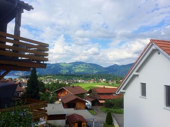 Houses and buildings against sky