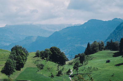 Scenic view of landscape and mountains against sky