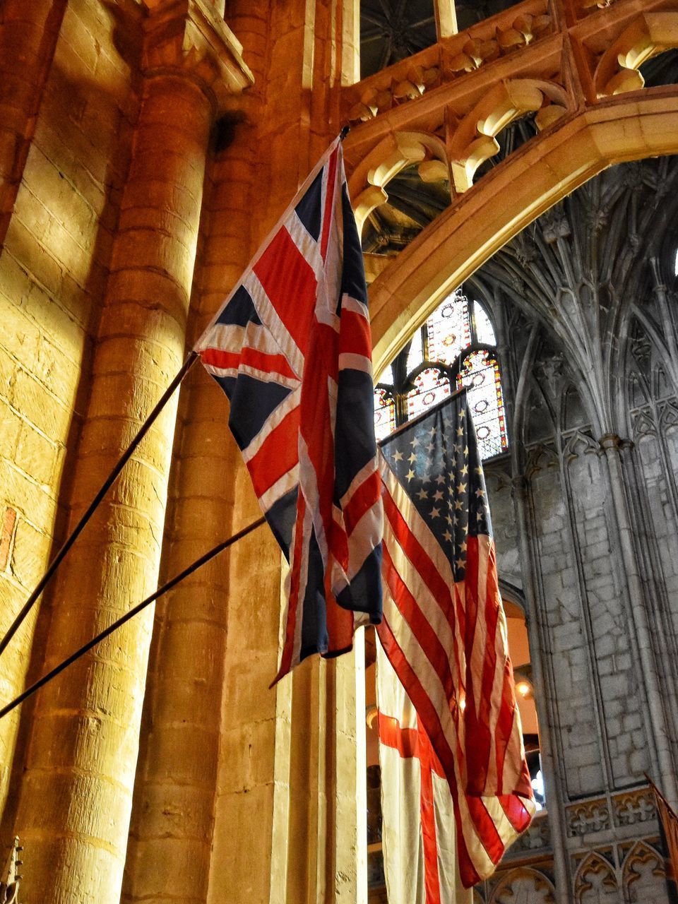 LOW ANGLE VIEW OF FLAG AGAINST BUILDINGS