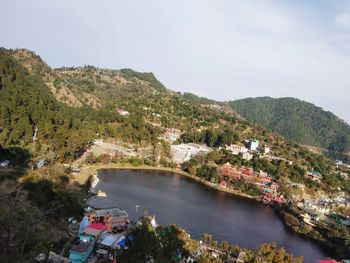 High angle view of river amidst trees against sky