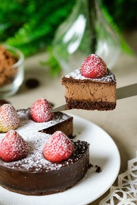 Close-up of cake with strawberries in plate