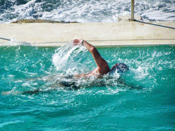 Man swimming in pool