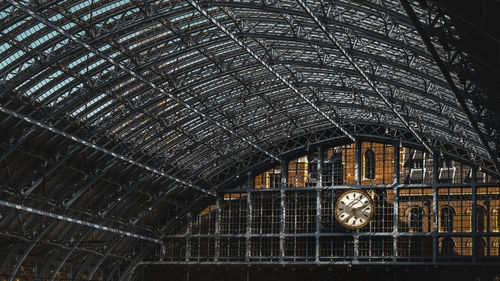 Low angle view of clock on roof