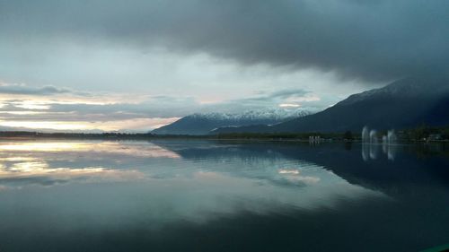 Scenic view of lake against cloudy sky