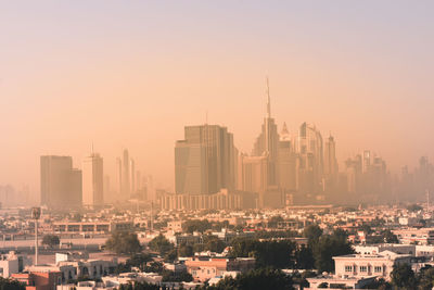 Modern buildings in city against clear sky