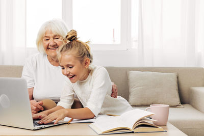 Boy using laptop at home