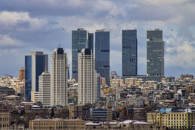 Modern buildings in city against sky