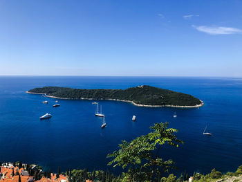 High angle view of bay against clear blue sky