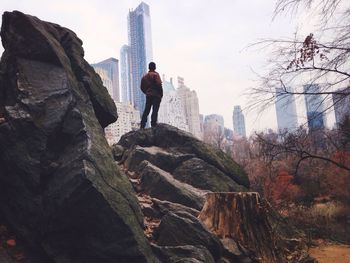 Woman standing on rock
