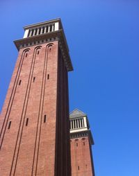 Low angle view of building against clear blue sky