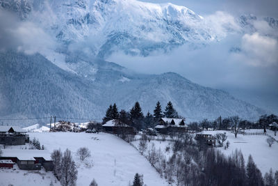 Scenic view of snow covered mountains against sky