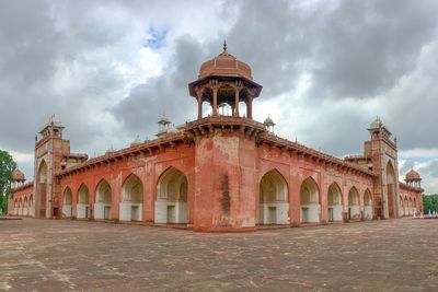 View of historic building against cloudy sky