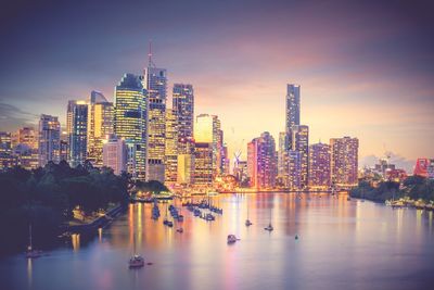 Illuminated buildings in city at night