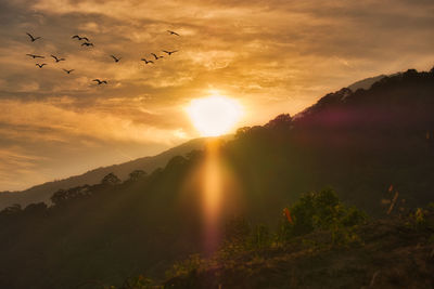 Scenic view of mountains against sky during sunset