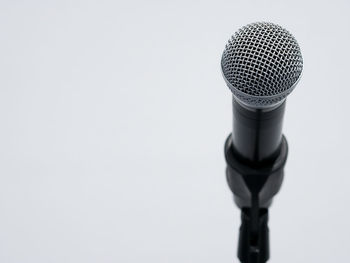 Close-up of telephone pole against white background