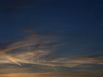 Low angle view of vapor trails in sky