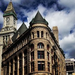 Low angle view of historical building against cloudy sky