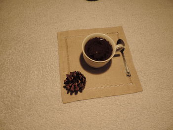 High angle view of coffee cup on table