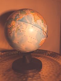 Close-up of illuminated lamp on table