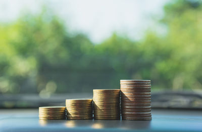 Close-up of stack of coins on car dashboard