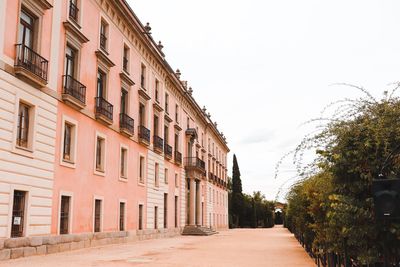 Street amidst buildings against sky