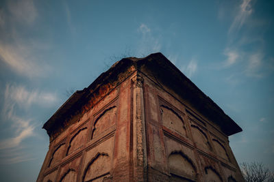 Low angle view of old building against sky