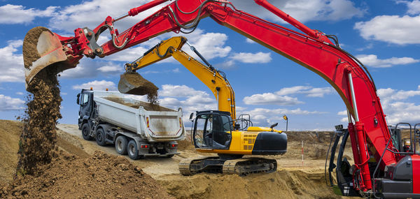 Excavator is working and digging at construction site