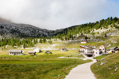 Scenic view of landscape and buildings against sky