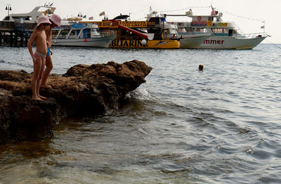 Man and woman in boat at sea