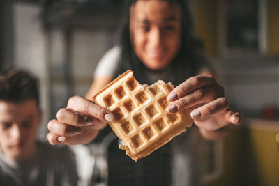 Close-up portrait of boy playing guitar