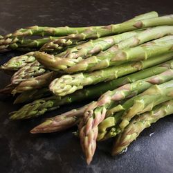 Close-up of wet asparagus on table