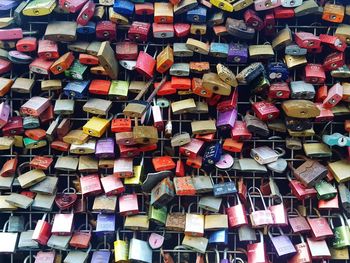 Full frame shot of padlocks on metal grate