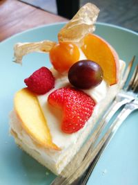 Close-up of strawberries on dessert at table