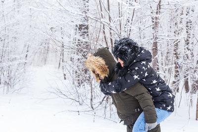 Man standing on snow covered land