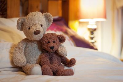 Teddy bears on bed at home