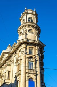 Low angle view of building against blue sky