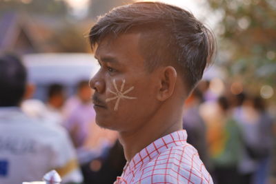 Close-up of man with face paint during event